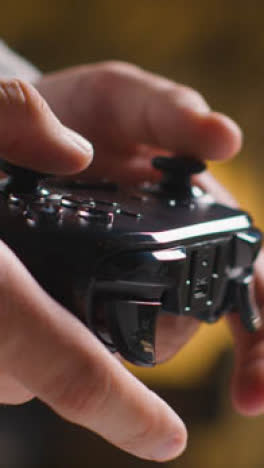 Vertical-Video-Side-View-Close-Up-Shot-Hands-Man-Playing-Video-Game-Controller-1